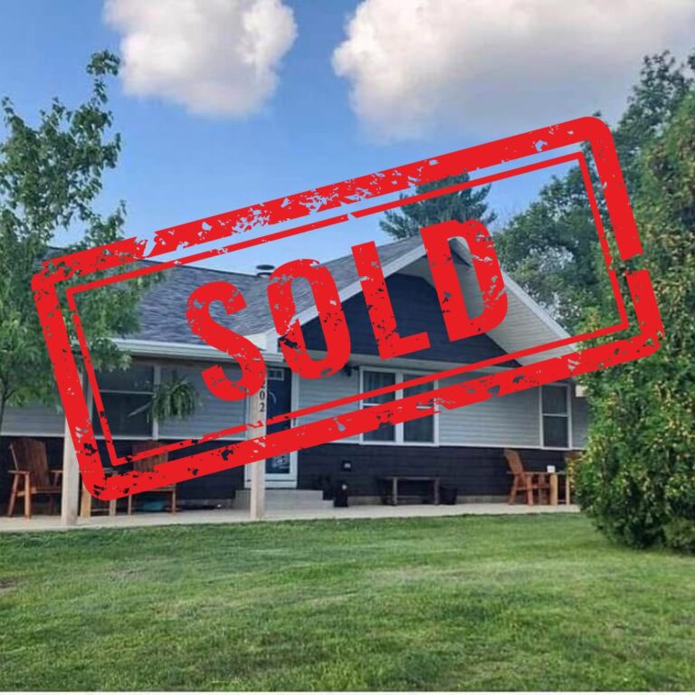 Image of home downsizing for empty nesters with text "sold" on it